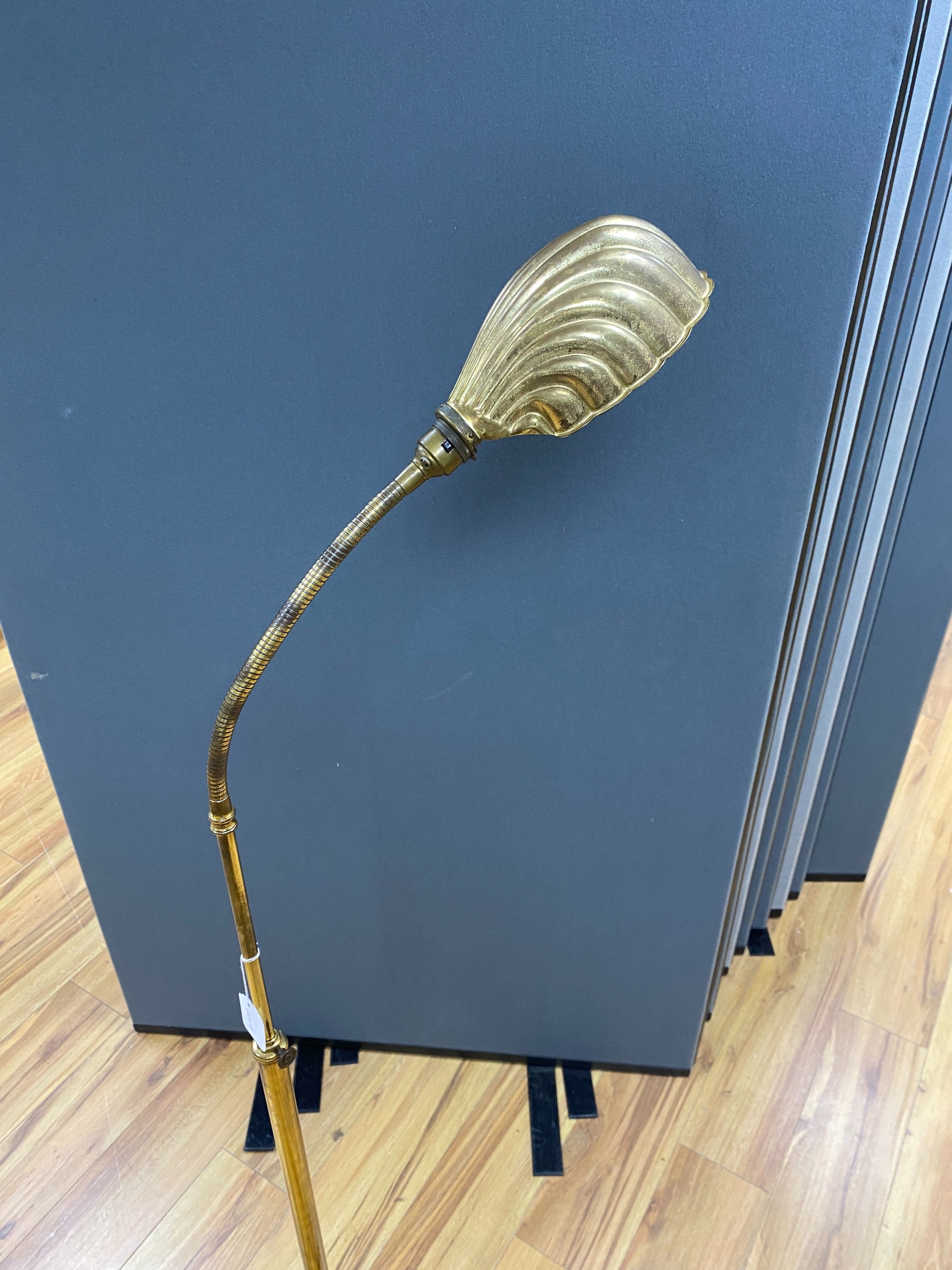 An early 20th century brass adjusting telescopic floor lamp